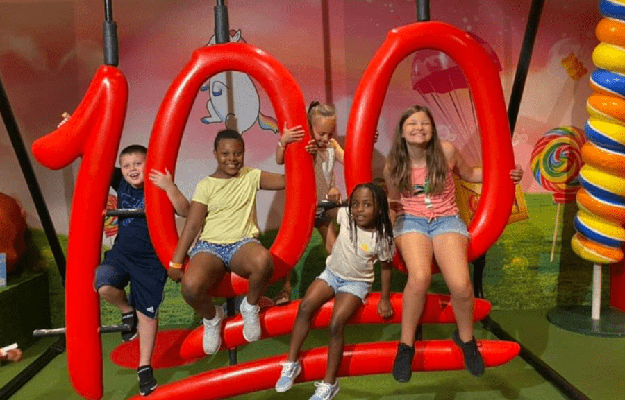 Kids Playing with 100 symbol on a Field Trip