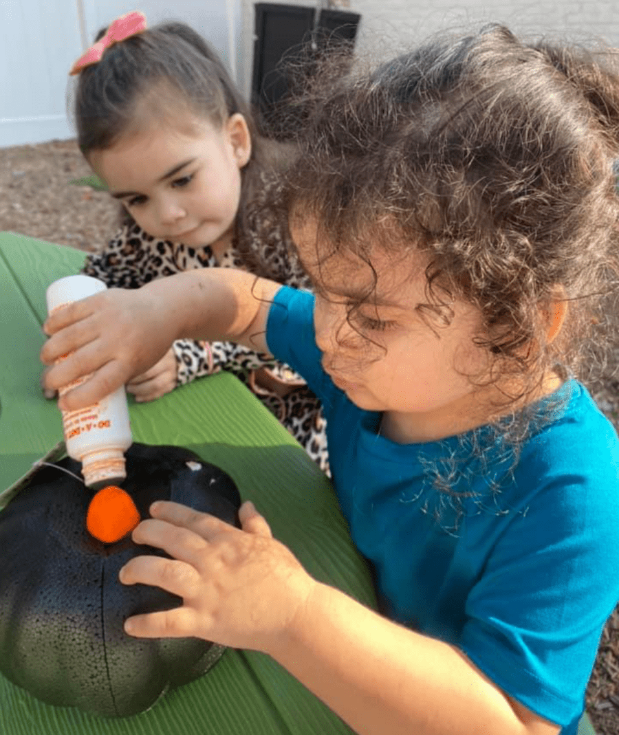 2 year olds making crafts outside